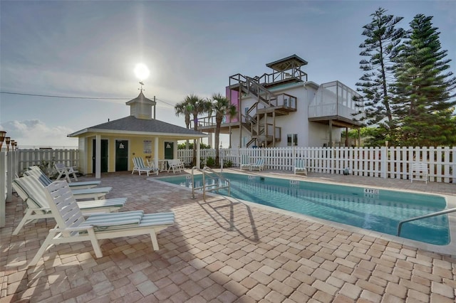 view of swimming pool with a patio area