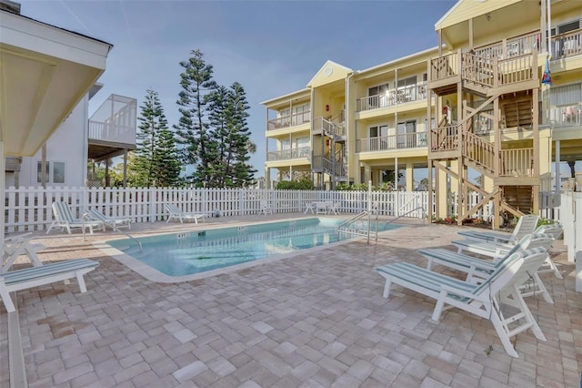 view of swimming pool with a patio area