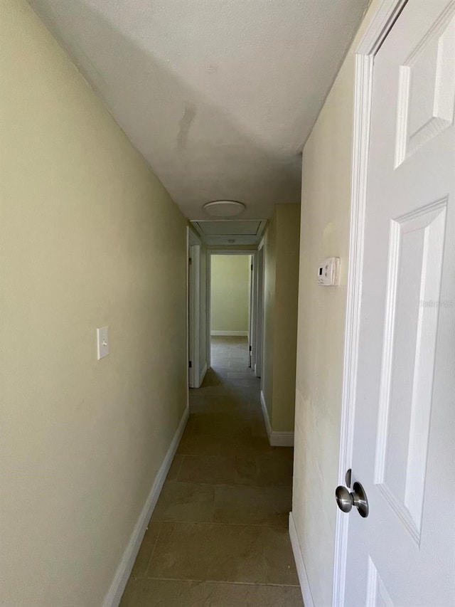 hallway with tile floors