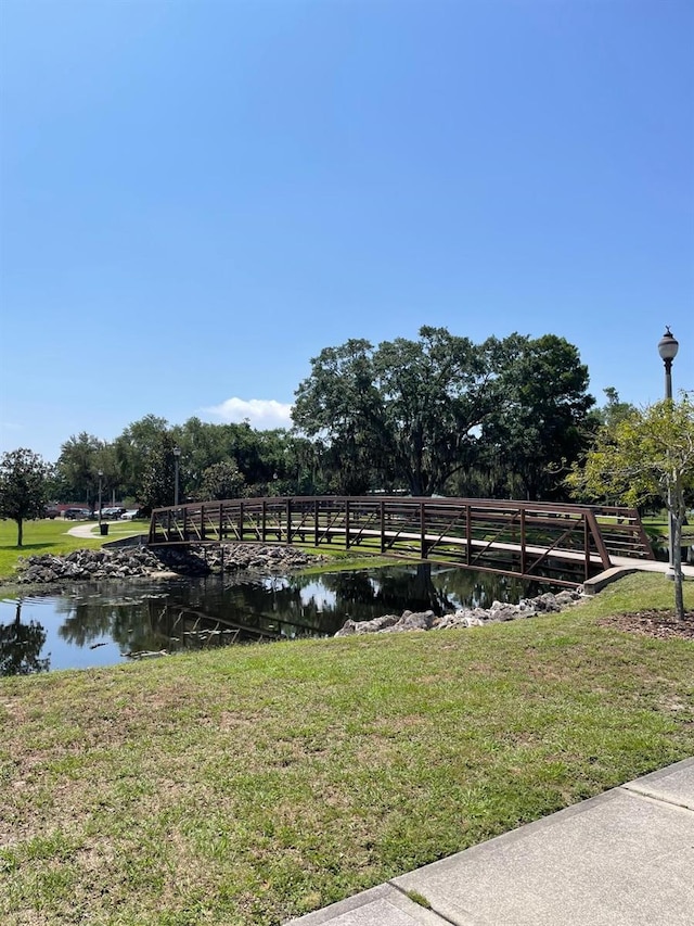 exterior space with a yard and a water view