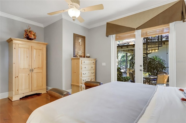 bedroom featuring hardwood / wood-style flooring, ornamental molding, ceiling fan, and access to exterior