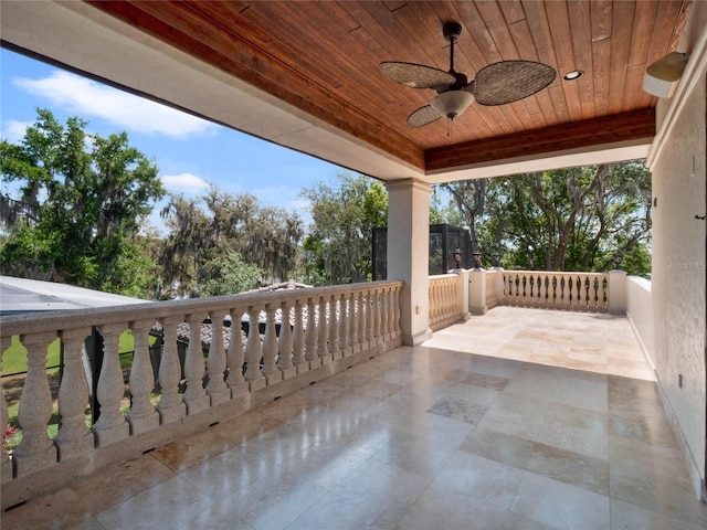 view of patio featuring a balcony and ceiling fan