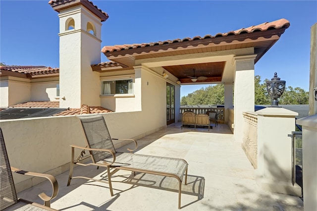 view of patio / terrace featuring ceiling fan