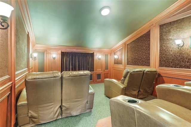 carpeted home theater with crown molding