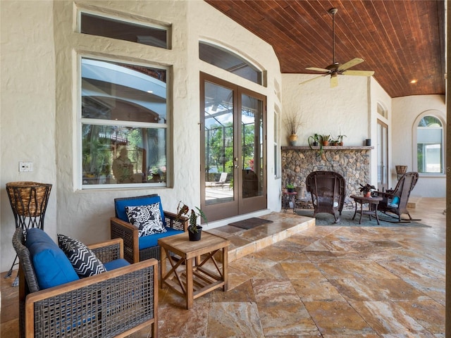 view of terrace with an outdoor living space and ceiling fan