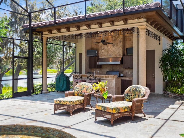 view of terrace with a lanai and ceiling fan