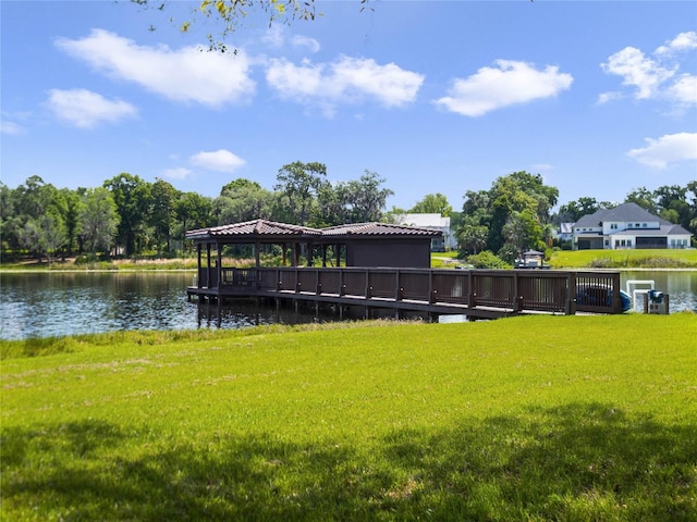 exterior space featuring a water view and a lawn