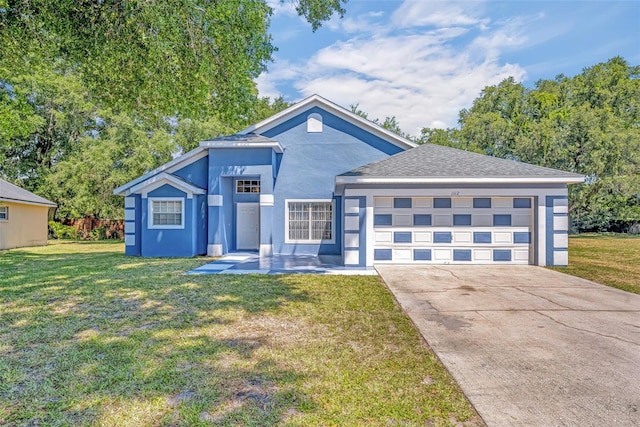 view of front facade featuring a garage and a front lawn