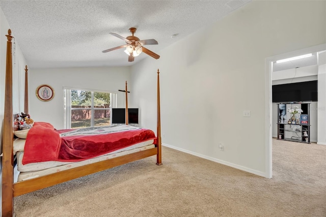 carpeted bedroom with ceiling fan, a textured ceiling, and lofted ceiling