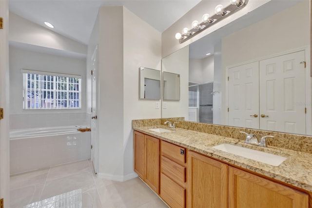 bathroom featuring vanity, tile patterned flooring, vaulted ceiling, and independent shower and bath