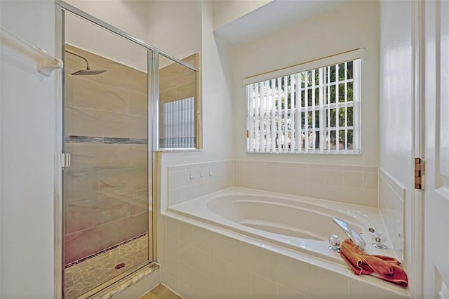 bathroom with shower with separate bathtub