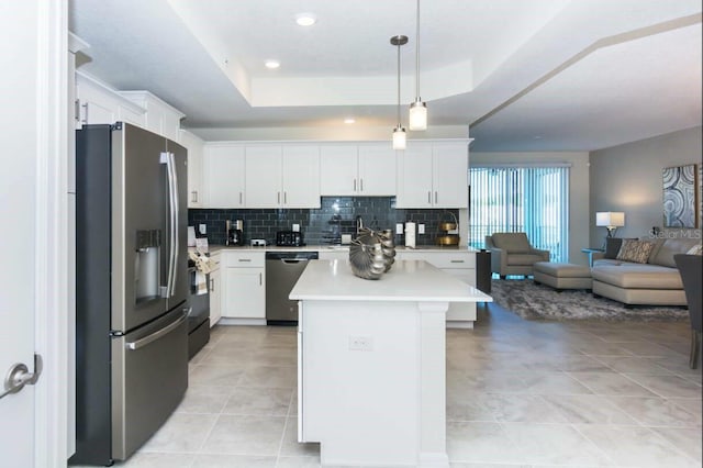 kitchen with stainless steel fridge with ice dispenser, dishwasher, a raised ceiling, and white cabinets