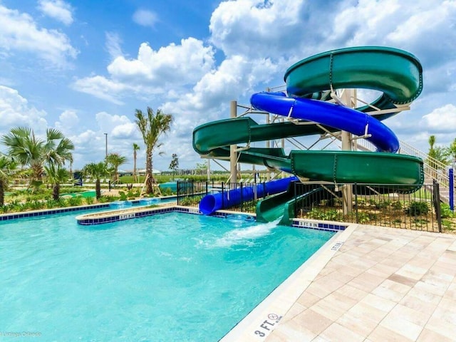 view of pool featuring a water slide