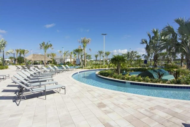 view of swimming pool featuring a patio