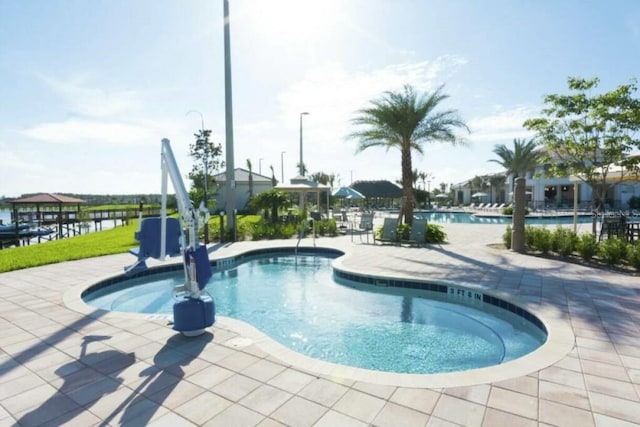 view of swimming pool featuring a patio