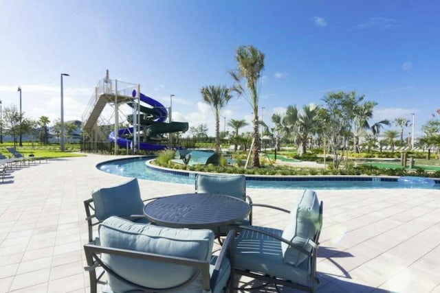 view of terrace with a community pool