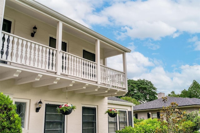 view of home's exterior featuring a balcony