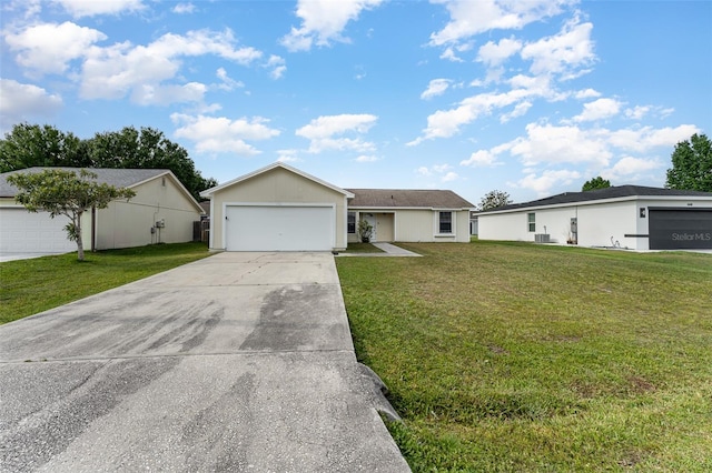 ranch-style home with a garage and a front lawn