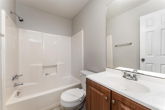 full bathroom featuring washtub / shower combination, vanity, toilet, and tile floors