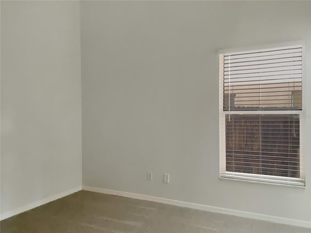 unfurnished room featuring concrete floors