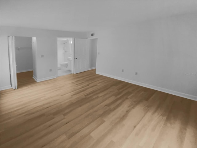 empty room featuring wood-type flooring