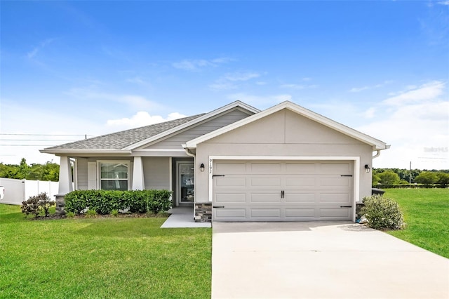 view of front of house with a front lawn and a garage