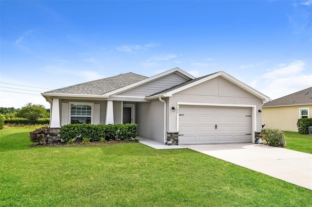 view of front of home with a front lawn and a garage