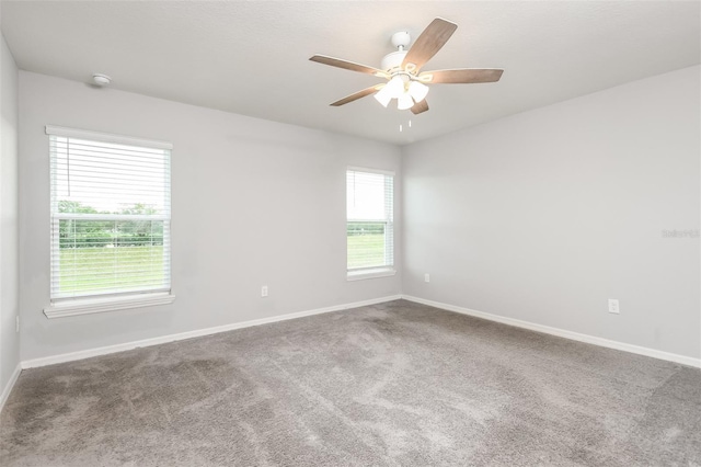 carpeted empty room with ceiling fan