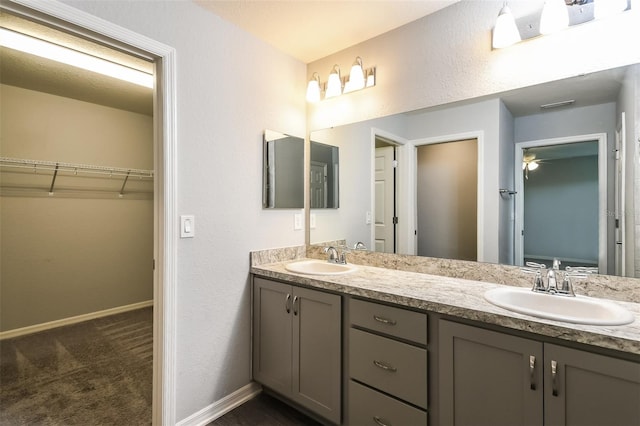 bathroom featuring dual bowl vanity