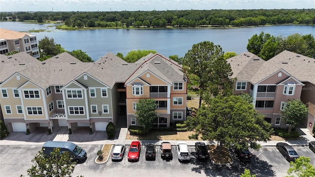 birds eye view of property featuring a water view