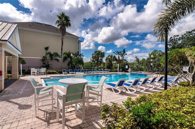 view of pool featuring a patio area