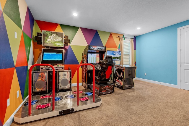 rec room featuring carpet flooring and a textured ceiling