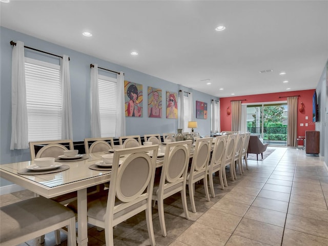 dining space with light tile floors