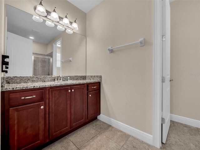 bathroom featuring tile flooring and vanity