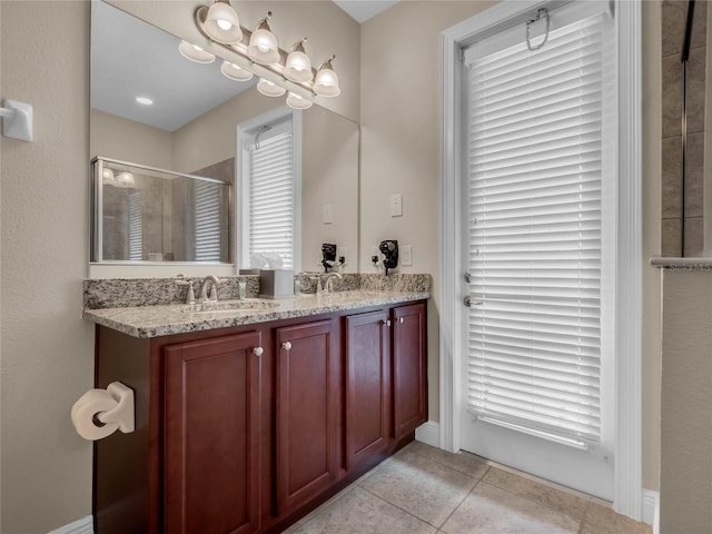 bathroom featuring tile flooring and dual bowl vanity