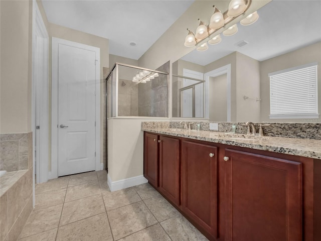 bathroom with oversized vanity, tile floors, dual sinks, and separate shower and tub