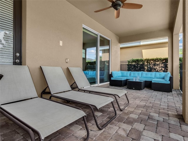 view of patio / terrace with an outdoor living space and ceiling fan