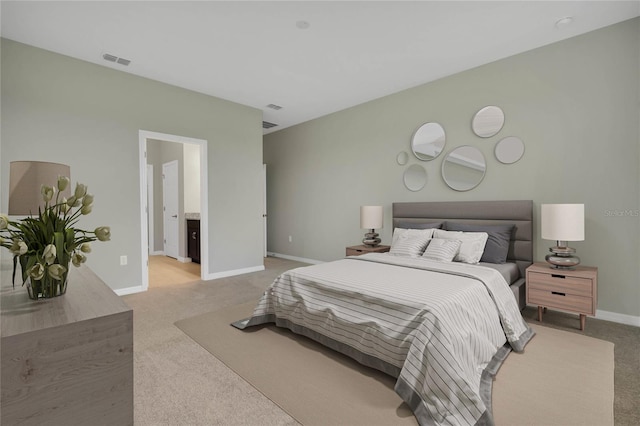 bedroom featuring light colored carpet