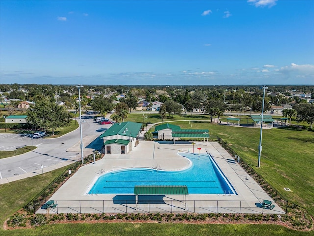 view of pool featuring a yard