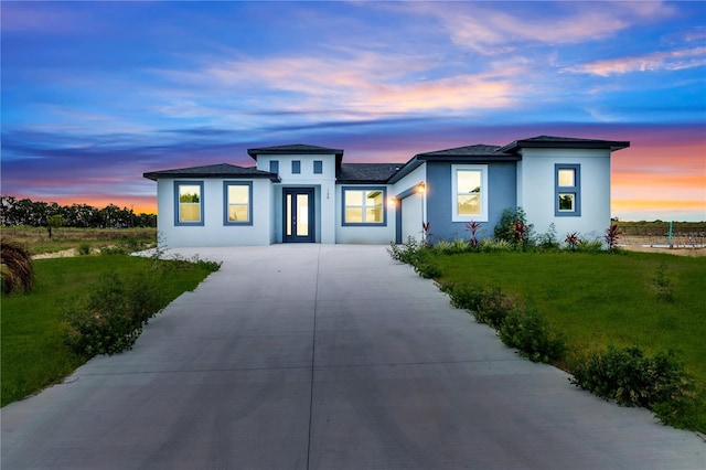 prairie-style home featuring a yard