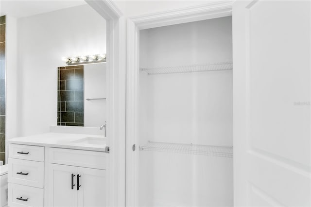 bathroom with vanity and toilet