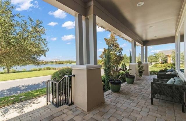 view of patio featuring a water view