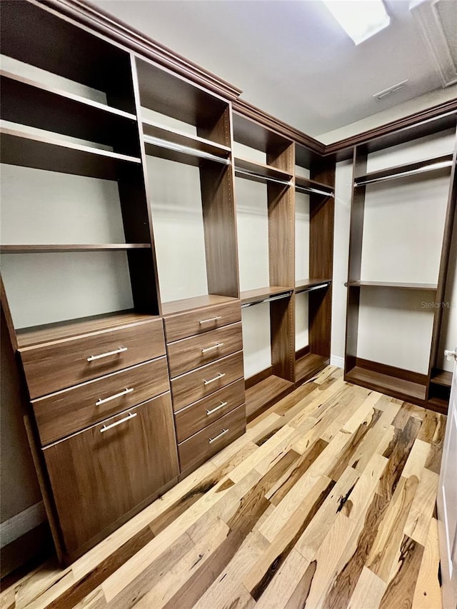 walk in closet featuring light wood-type flooring