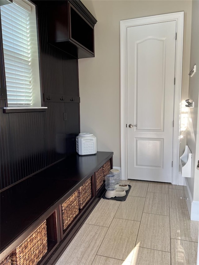 mudroom with light tile floors