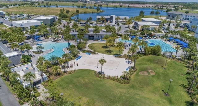 birds eye view of property with a water view