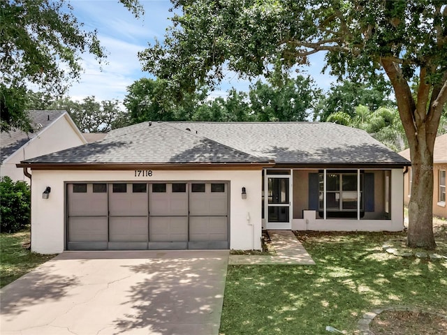 ranch-style house with a front lawn and a garage