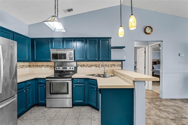 kitchen featuring light tile patterned floors, appliances with stainless steel finishes, sink, and hanging light fixtures