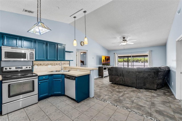 kitchen featuring light tile patterned flooring, sink, a textured ceiling, ceiling fan, and stainless steel appliances