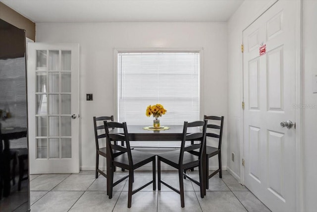 dining area featuring light tile patterned floors