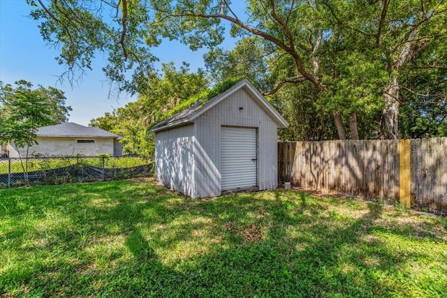 view of outdoor structure featuring a lawn